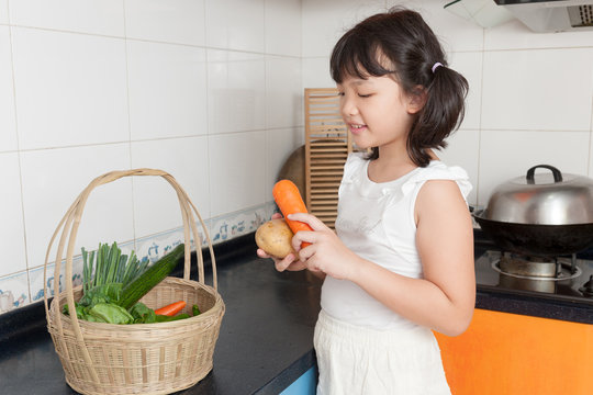 Asian Kid In Kitchen