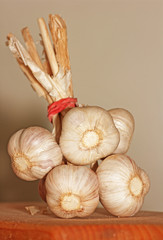 Garlic on a wooden kitchen board.
