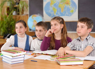 Four pupils in classroom