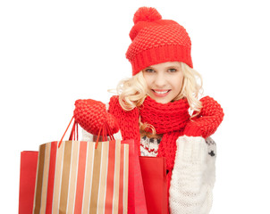 young girl with shopping bags