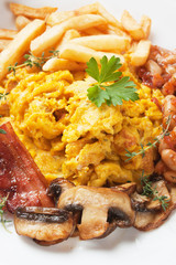 Scrambled eggs with mushrooms and bacon