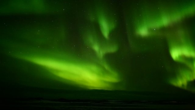 Green Aurora Borealis on the Arctic sky, Svalbard