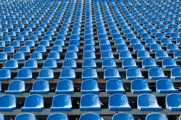 blue seats for spectators in the stadium