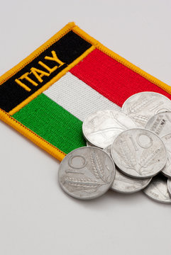 italy flag and lira coins