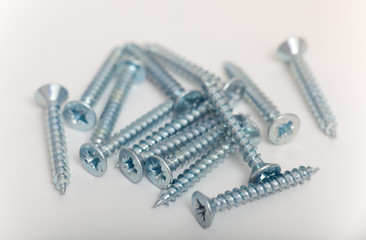 Screws over white background