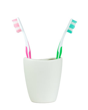 green and pink tooth brush turn back to back