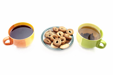 Cups with tea and cookies