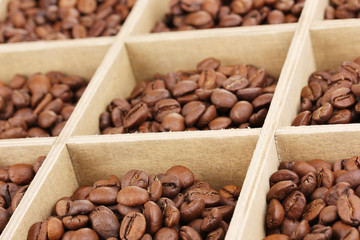Coffee beans in wooden box close-up