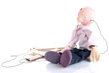 Wooden puppet sitting isolated on white