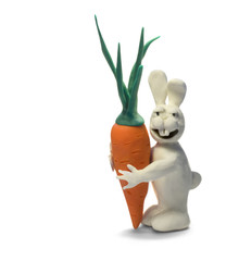 clay happy rabbit hugs carrot isolated