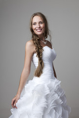 beautiful smiling girl in a white wedding dress