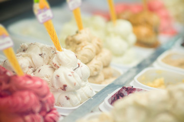 Variety of yummy ice creams under shopping window