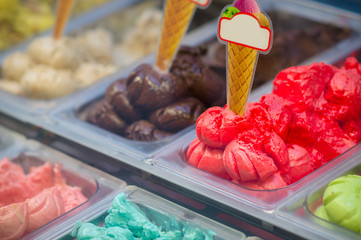 Variety of yummy ice creams under shopping window