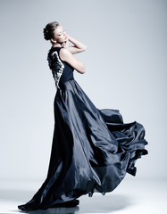 fine art fashion photo of beautiful woman model in elegant dress
