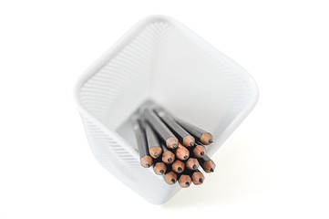 Black pencils and the yellow one on isolated white background