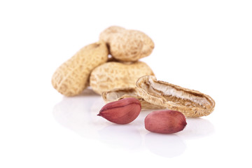 peanuts cracked open isolated on a white background