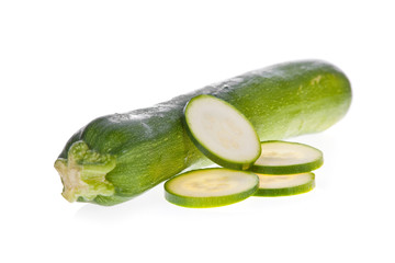 Sliced zucchini or courgette isolated on a white background.