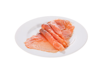 Smoked salmon slices in a dish isolated on white background
