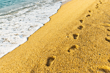 Footprint on sand with foam