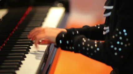 the girl plays the piano