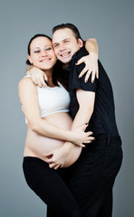 Portrait of a happy pregnant couple. young pregnant couple. happ