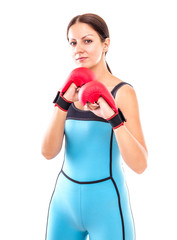 Pretty girl in boxing gloves pose, isolated on white