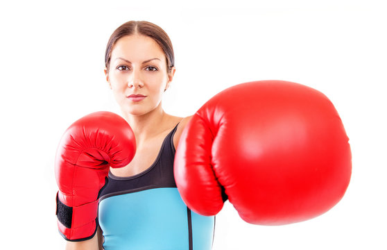 Pretty girl in boxing gloves pose, FOCUS ON FACE