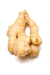 Root ginger on a white studio background.