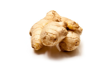 Root ginger isolated on a white studio background.