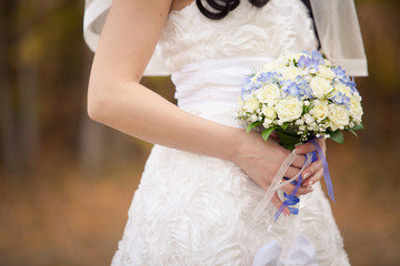 Bride with bouquet, closeup
