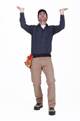 Laborer gesturing on white background