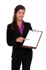 Businesswoman with a blank clipboard