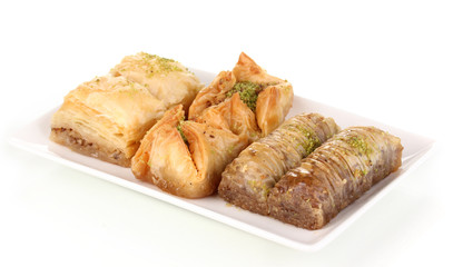 Sweet baklava on plate isolated on white