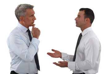 Two businessmen discussing.