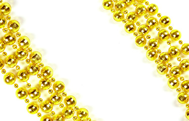 Background made of a brilliant celebratory beads of golden color