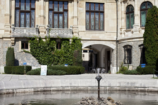 stone fountain in front of castle