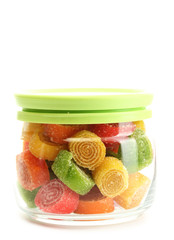 colorful jelly candies in glass jar isolated on white.
