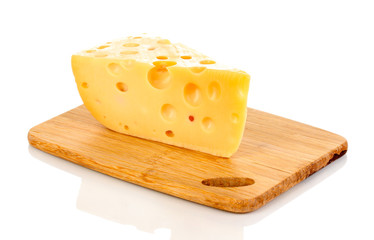 tasty cheese on wooden board isolated on white