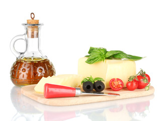 sliced mozzarella cheese with vegetables isolated on white