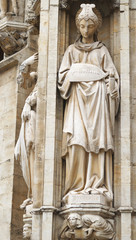 Statue of Prudence decorating gothic facade