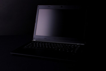 a silhouette of leptop