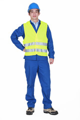 Fototapeta premium Construction worker standing on white background