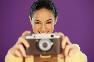 Pretty woman taking a photograph
