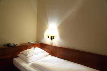 Hotel room with bed, telephone