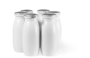 bottle with foil cap, date with yogurt stand on table