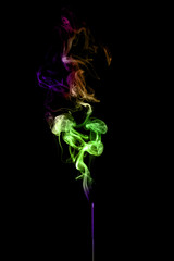 colored smoke shapes in various colors isolated on black