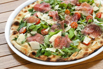 Close up of Italian smoked ham pizza.