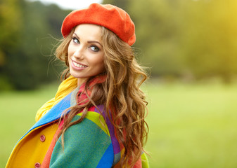 Fashion woman walking in autumn park