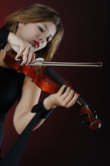 Beutiful musician playing violin