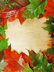 Naklejka na ściany i meble Herbstblätter um Holztafel